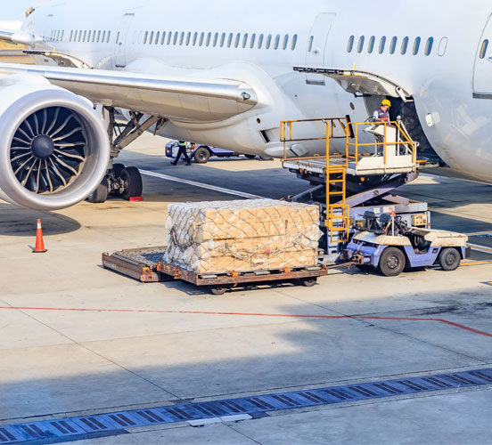 Airplane moving cargo into the hold