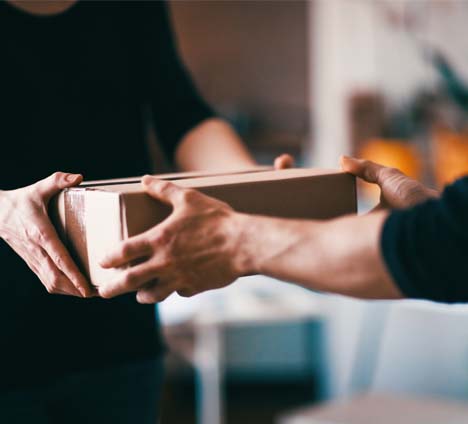2 people exchanging package