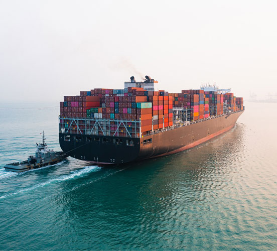 Cargo ship sailing out to sea