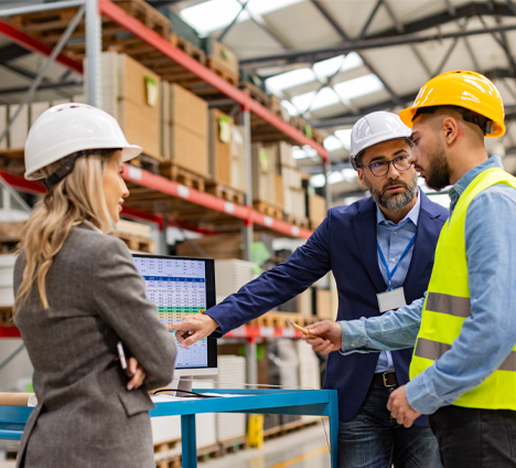 2 people in warehouse discussing project logistics